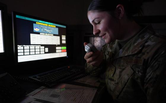 Photo Of U.S. Air Force Senior Airman Lydia Heflin speaks into a giant voice system at Osan Air Base.