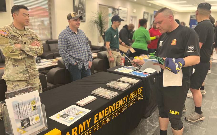 A visitor at Army Emregency Relief booth.