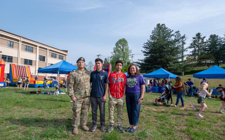 U.S. Air Force Master Sgt. Justin Canizales, 51st Security Forces Squadron plans and programs superintendent, and his family celebrate Month of the Military Child at the Bubbles and Bounce event at Osan Air Base, Republic of Korea, April 19, 2024. MOMC is celebrated annually at Osan AB to commemorate the sacrifices and resilience of military children while being a part of the armed forces family.