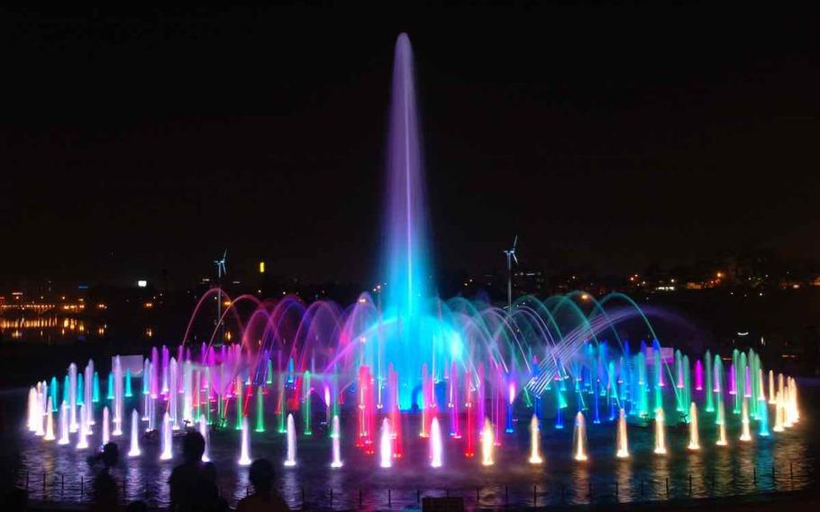 Jinju Namgang Music Fountain. the fountain is illuminated.