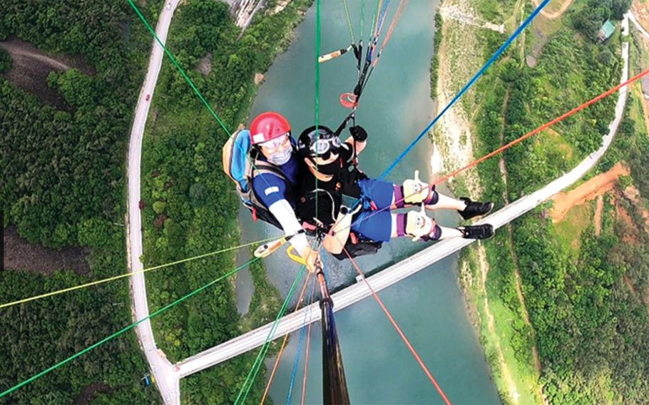 Two people taking selfie as they enjoy an outdoor activity.
