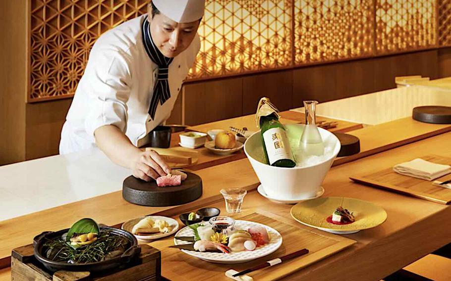 a chef is working in the kitchen.