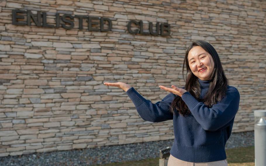 Ms. Chong, Chu Hyon poses for a photo outside the enlisted club at Osan Air Base.