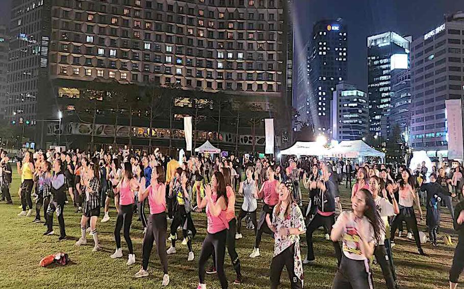 participants dancing in the plaza.