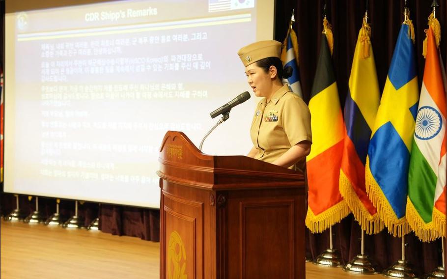 Cmdr. Hannah M. Shipp, incoming commanding officer of Busan, South Korea-based Military Sealift Command Office -Korea, speaks at the change of command ceremony.