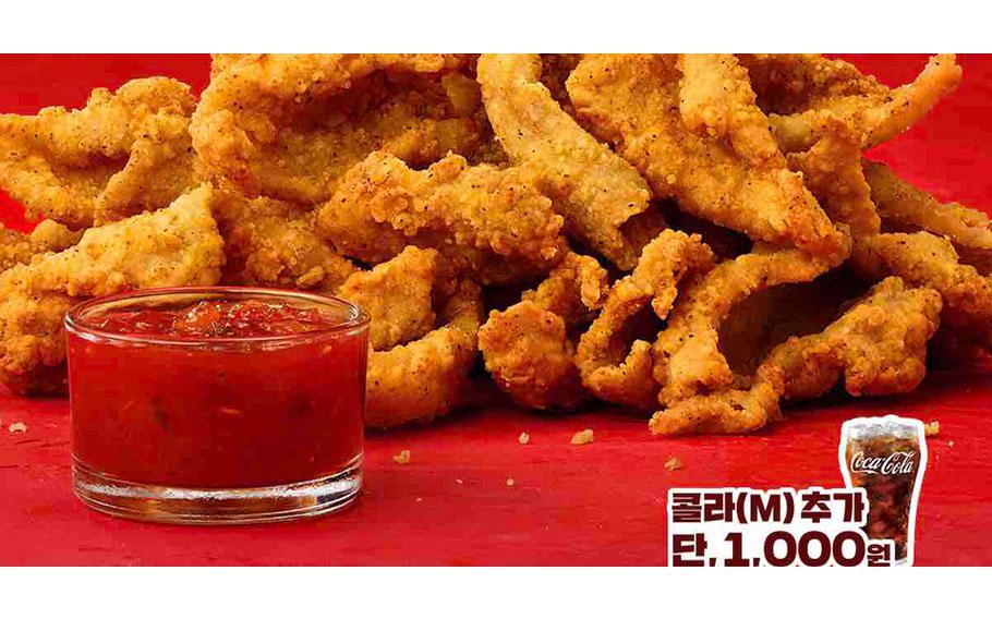 Chicken Skin Crisps with ketchup and a glass of coke.