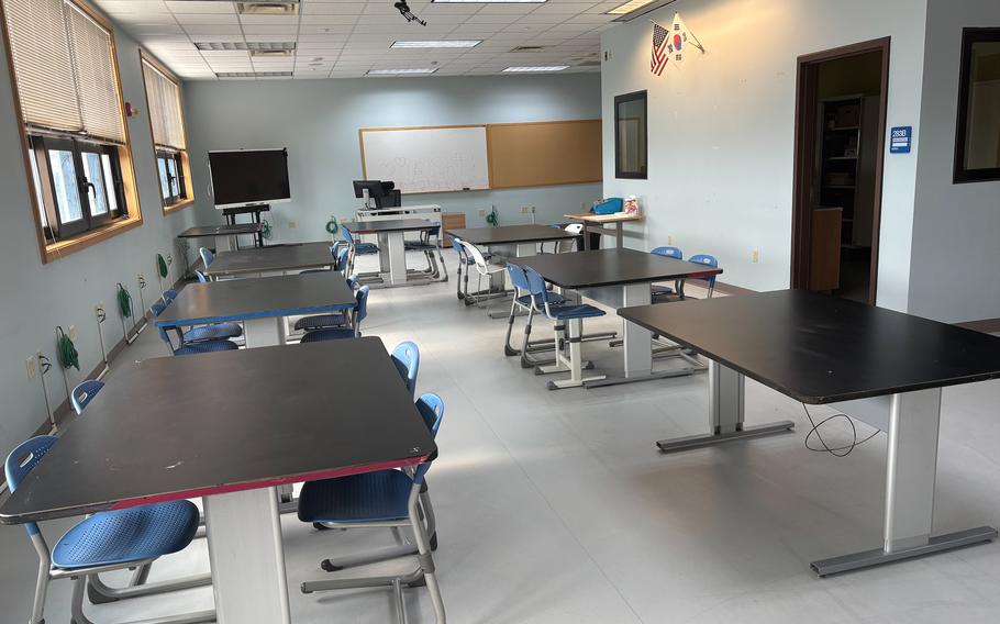 There are some desks and chairs in the new art room.