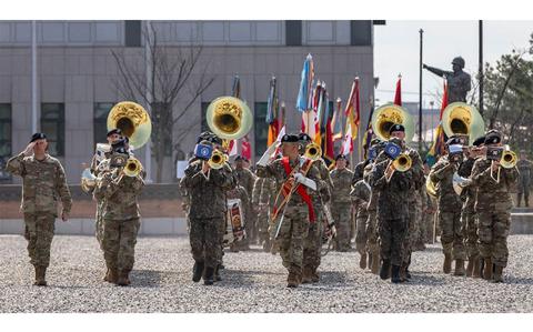 Photo Of U.S. Army Soldiers assigned to the Eighth Army Band conduct pass and review.