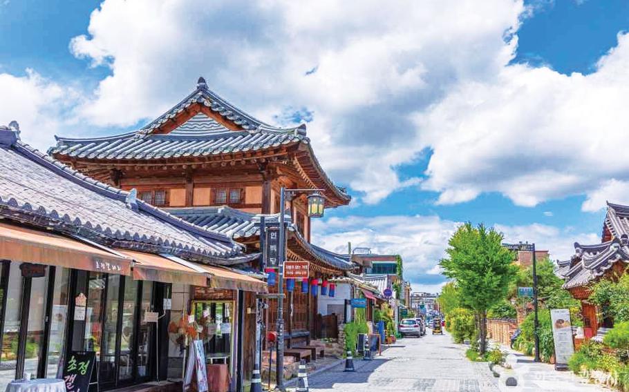 The street is lined with Korean traditional houses on both sides.