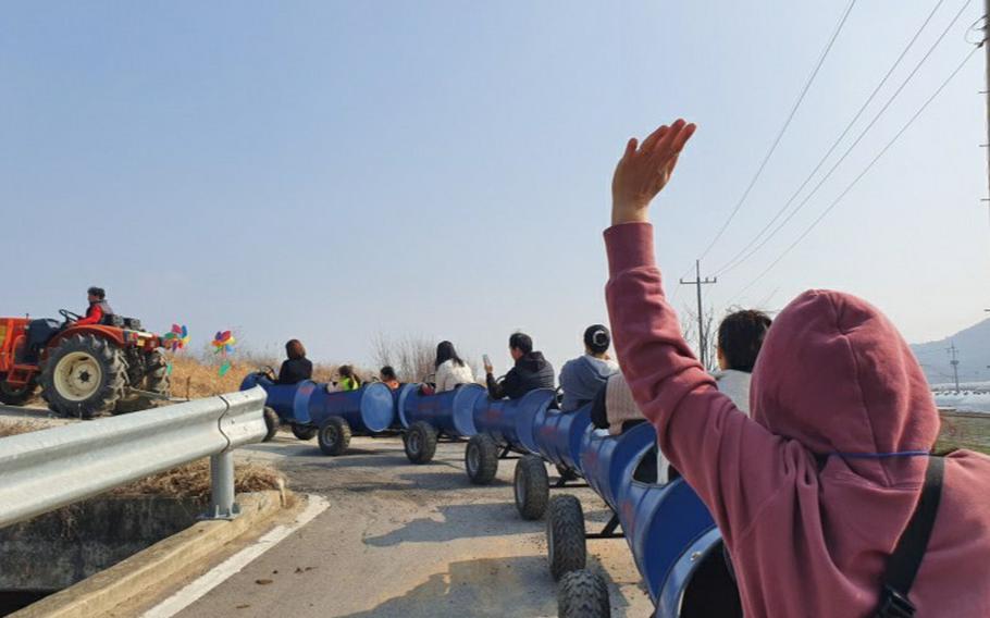 visitors are enjoying barrel train ride.