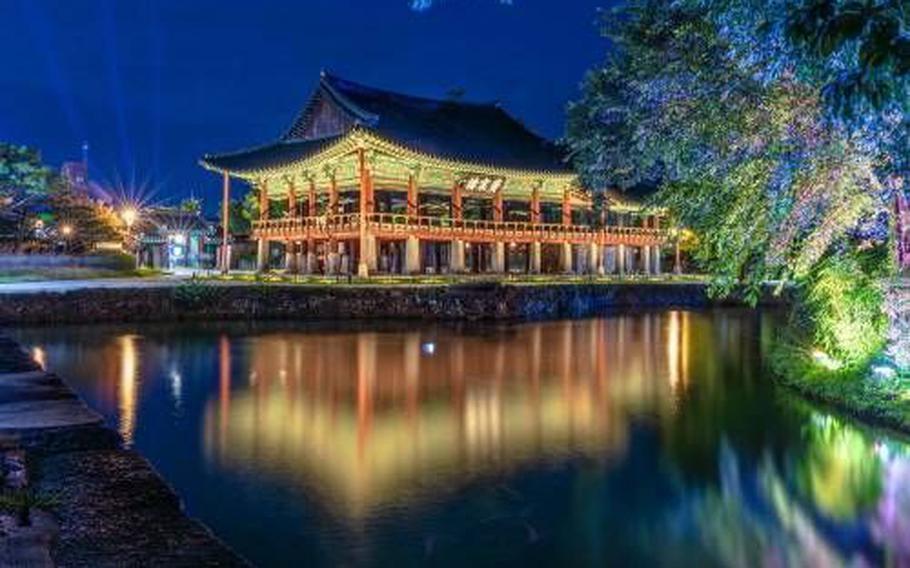 Gwanghalluwon Garden is lit up at night.