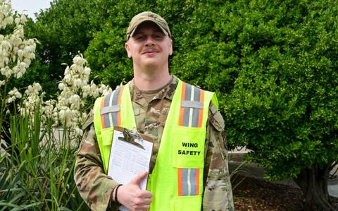 Photo Of U.S. Air Force Staff Sgt. Tyler Plourde poses for a photo outside the 8th FW headquarters.