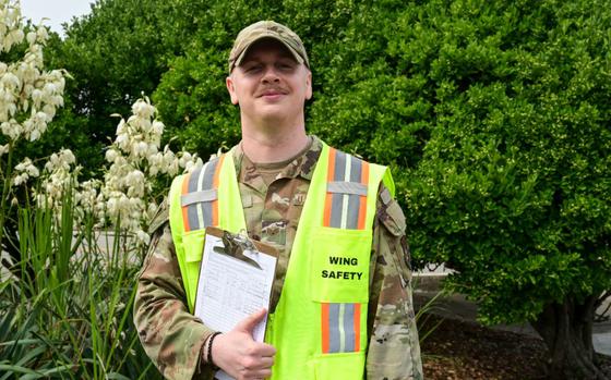 U.S. Air Force Staff Sgt. Tyler Plourde poses for a photo outside the 8th FW headquarters.