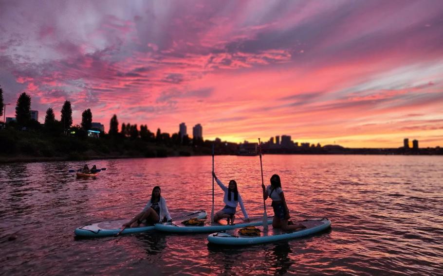 Paddleboarding during a stunning sunset at the Hangang River