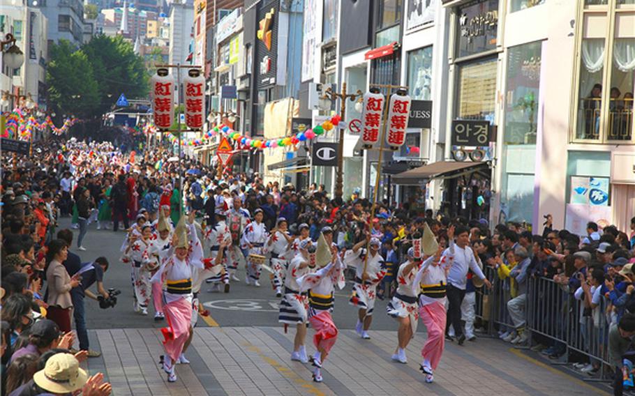 people are dancing on the street.