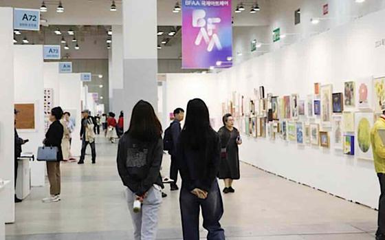 Visitors are enjoying in a museum.