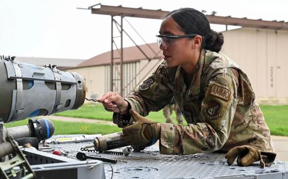 Senior Airman Sarai Perez, 8th Maintenance Squadron conventional maintenance technician, prepares a munition for loading during the 2024 2nd Quarter Dedicated Crew Chief and Load Crew Competition at Kunsan Air Base, Republic of Korea, July 12, 2024. These events are held by selecting one team for each quarter until winners face off in the annual load crew competition.