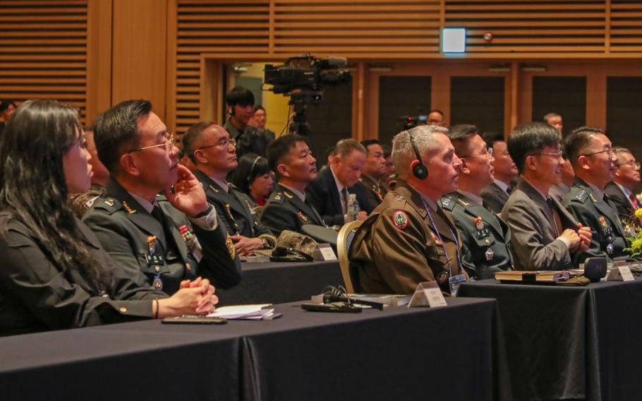 Eighth Army deputy commanding general, operations, Brig. Gen. Sean Crockett, listens to the speech translated into English at the 16th International Army Modeling and Simulations Conference in Daejeon, South Korea, Oct. 30, 2023.