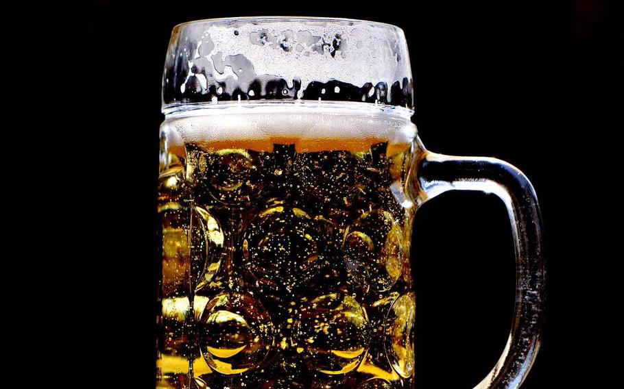 A full close-up photo of a glass of beer.
