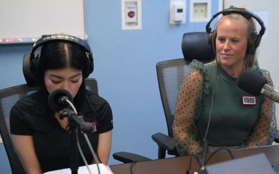 Kristen Loflin, the USO Indo-Pacific regional marketing and communications specialist, and Mari Velasquez, an area specialist for USO Okinawa, are interviewed by Seaman Tyler Jackson, an American Forces Network radio host, on Camp Butler, Okinawa, April 1, 2025.