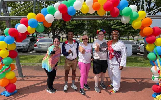 Osan+ committee members take a group photo during a color walk, crawl, run 5K event to kick-off Pride Month at Osan Air Base, Republic of Korea, June 1, 2024. During the month of June, Osan AB recognizes and values the contributions of the Department of Defense civilian employees and service members in the Lesbian, Gay, Bisexual, Transgender and Queer community. 