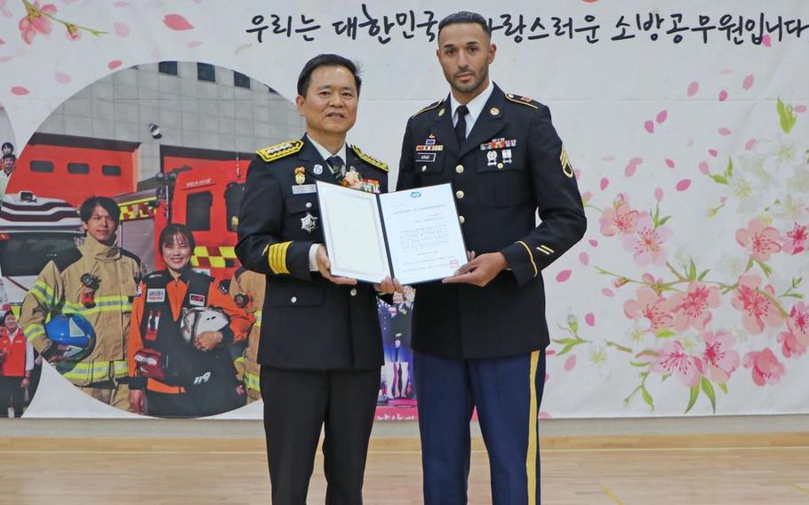 Staff Sgt. Shaw Kras poses with the award on his hand. 