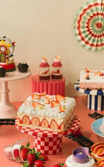 strawberry dishes and sweets on the table.