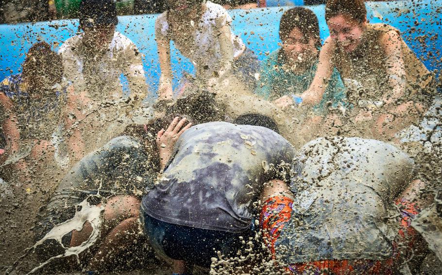 Participants enjoy the Boryeong Mud Festival.