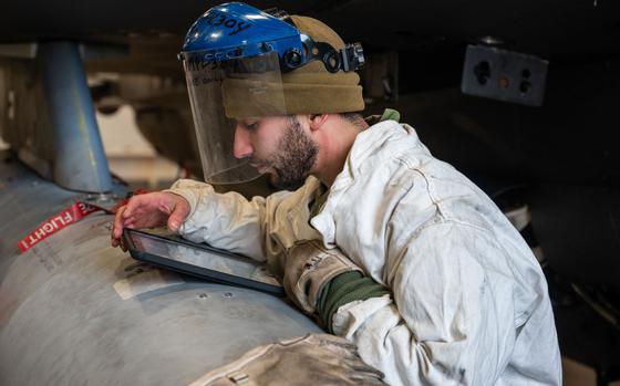 U.S. Air Force Staff Sgt. Sergio Sanchez, 36th Fighter Generation Squadron electrical and environmental technician, reads instructions from technical orders during the Ninja Mustang training event at Misawa Air Base, Japan, March 6, 2024. Ninja Mustang allows the 51st FW to develop the lethality and readiness of its Airmen in the event of strategic relocation to deter potential threats. The event involved participation from the 51st Fighter Wing and the 13th Fighter Squadron, to test the operational capabilities of the 51st FW after relocating to other bases within the pacific. 