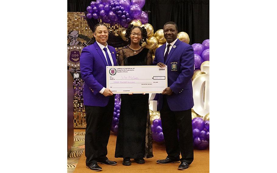 2nd Place Winner – Julia McCants from Humphreys High School receives a $300 check from the Brothers of Lambda Xi Chapter of Omega Psi Phi Fraternity, Inc. 