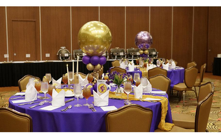 tables decorated with balloons.