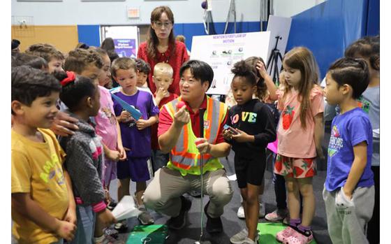 Mr. Christopher Brincefield, Programs Branch Chief, U.S. Army Corps of Engineers – Far East District, engages with students at a STEAM event hosted by USACE at Central Elementary School on Camp Humphreys, South Korea, on May 22. Highlighting the vital role of STEAM in our everyday lives, Mr. Brincefield inspires curiosity and a passion for learning through interactive and educational activities.
