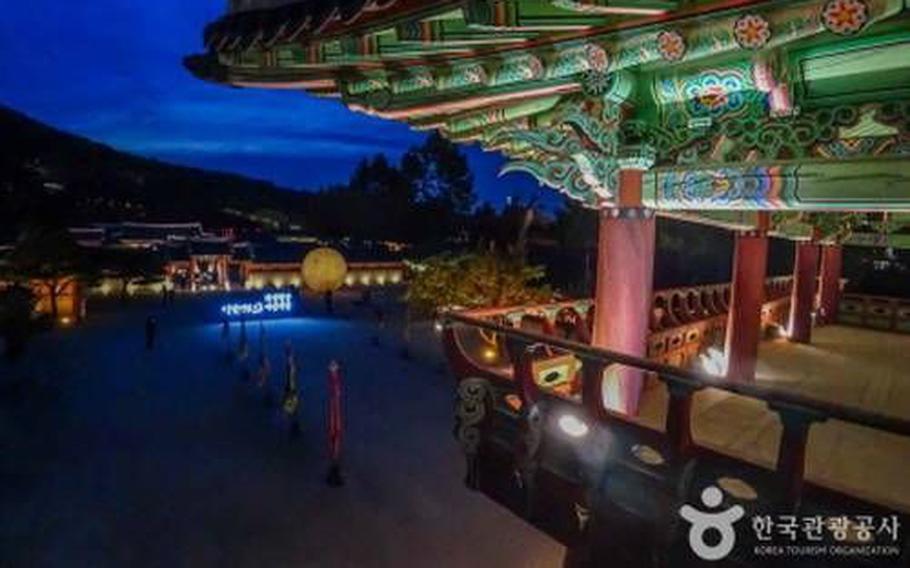 Suwon Hwaseong Fortress is lit up at night.