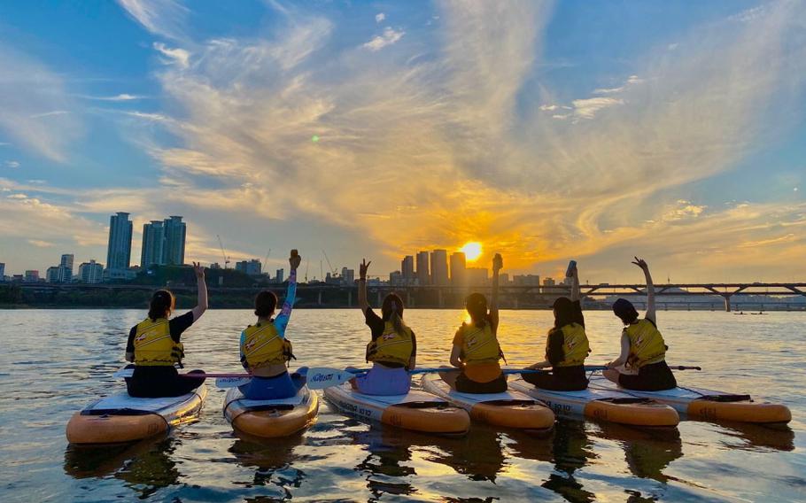 Paddleboarding during a stunning sunset at the Hangang River