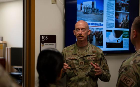 Photo Of U.S. Air Force Capt. Ryan Jackson is talking to the participants of the tour in front of a room.