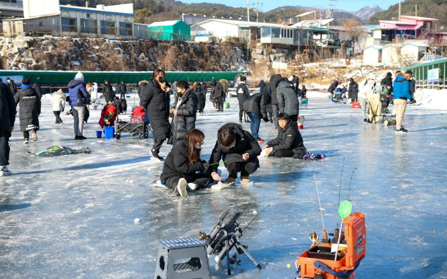 people enjoying ice fishing.