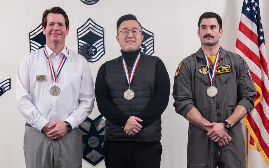 From left Mr. Donnie Parish, 8th Mission Support Group, Jongyou Kim, 8th MSG, and Maj Rex Anderson, 8th Operations Group, pose for a group photo after winning their respective categories during the 7th Air Force 2023 annual awards at Kunsan Air Base, Republic of Korea. There were 16 individual awards presented and one team award presented during the 2023 7th Air Force annual awards ceremony. 