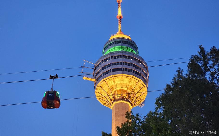 E-World 83 Tower and a ropeway can be seen.