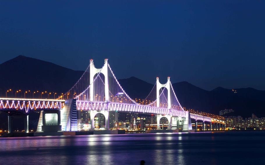 Illuminated bridge near Gwangalli Beach at night.