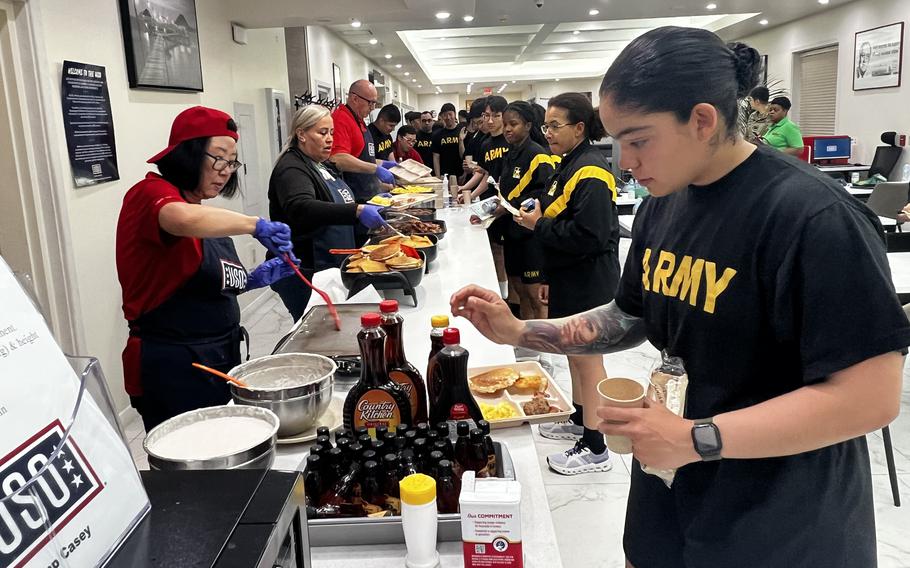Food is served at USO booth.