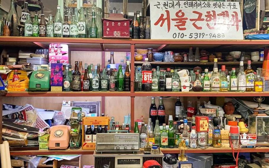 The interior of Seoul Folk Flea Market. Some empty bottles are displayed.
