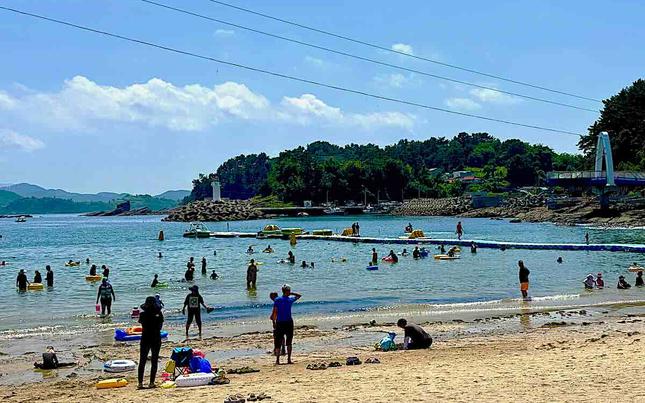 People are enjoying themselves on the beach.
