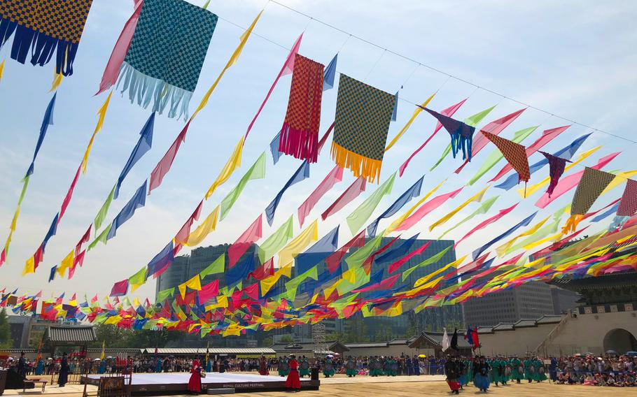 Pieces of cloth are hang in the ceremony site.