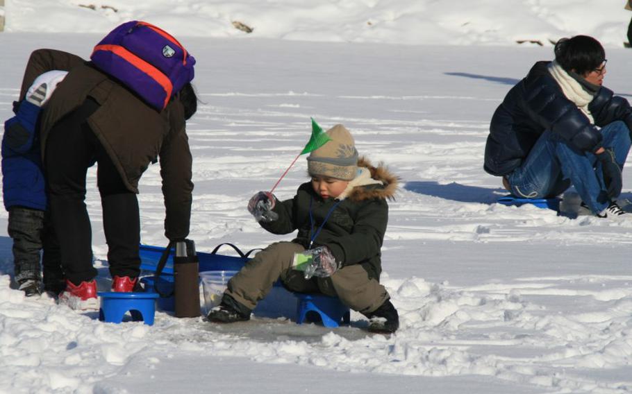 people enjoying ice fishing.