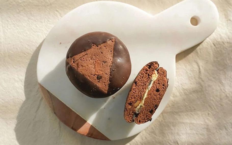 One and half chocolate pie are on a plate.