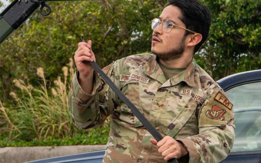 U.S. Air Force Senior Airman Bryan Ponce-Cisneros, 18th Comptroller Squadron financial operations technician, constructs a tactical operation center during an agile combat employment exercise at Kadena Air Base, Japan, Jan. 30, 2024