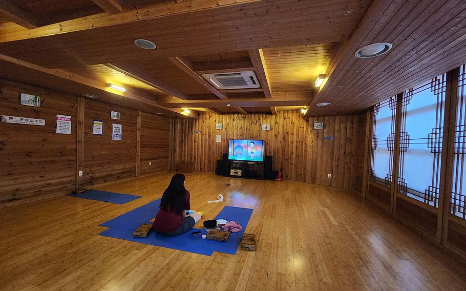 a person watching TV in the Relaxing room.