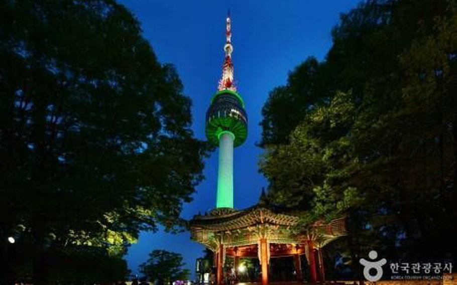 N Seoul Tower lihgts up at night.