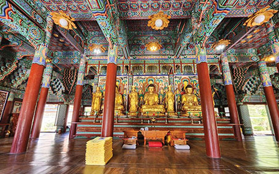 Inside Songgwangsa Temple. wooden floor and some statues.