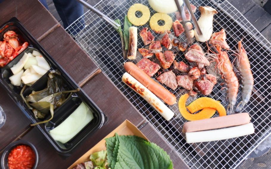 BBQ on a boat with a view of the river